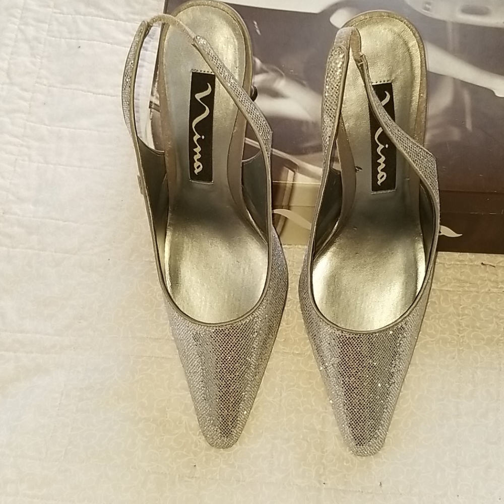 Never worn silver heels